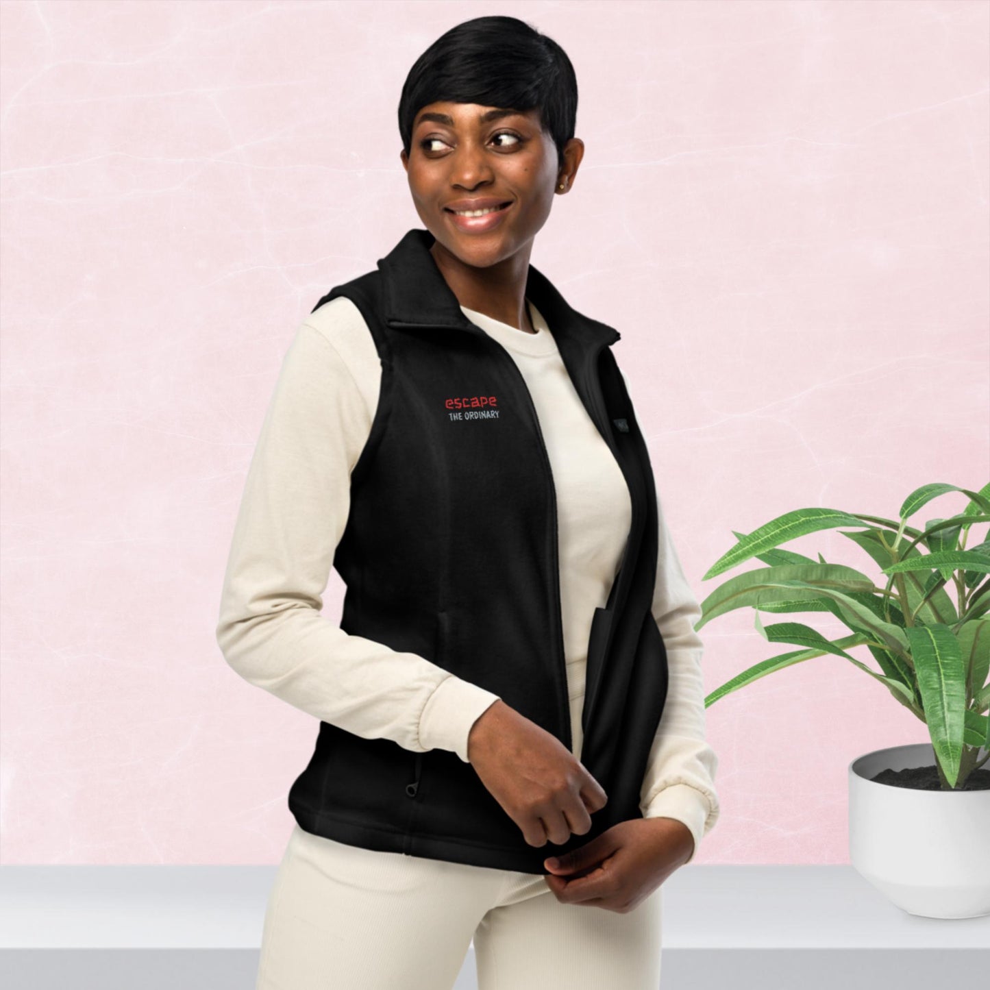 Women’s Columbia fleece vest, red/ grey color thread embroidery, "escape the ordinary", right chest.