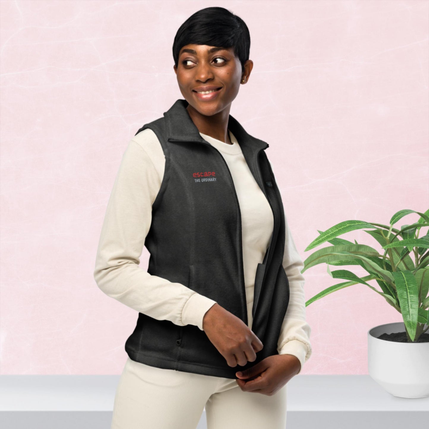 Women’s Columbia fleece vest, red/ grey color thread embroidery, "escape the ordinary", right chest.