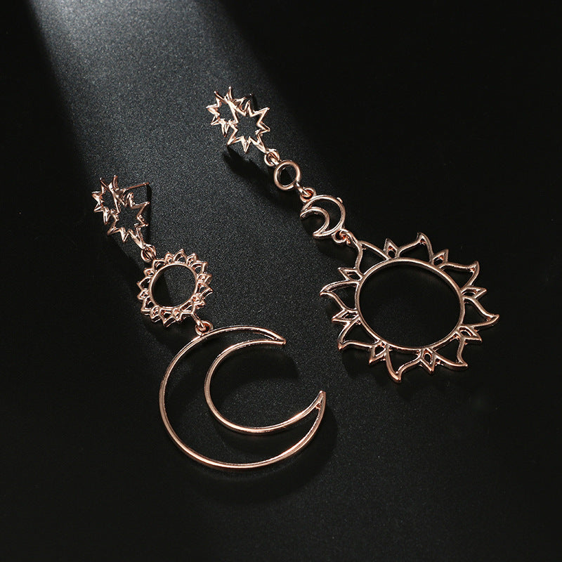 Asymmetric exaggerated moon sun earrings