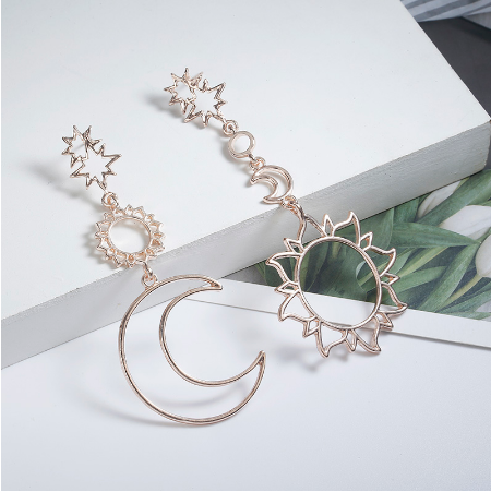 Asymmetric exaggerated moon sun earrings