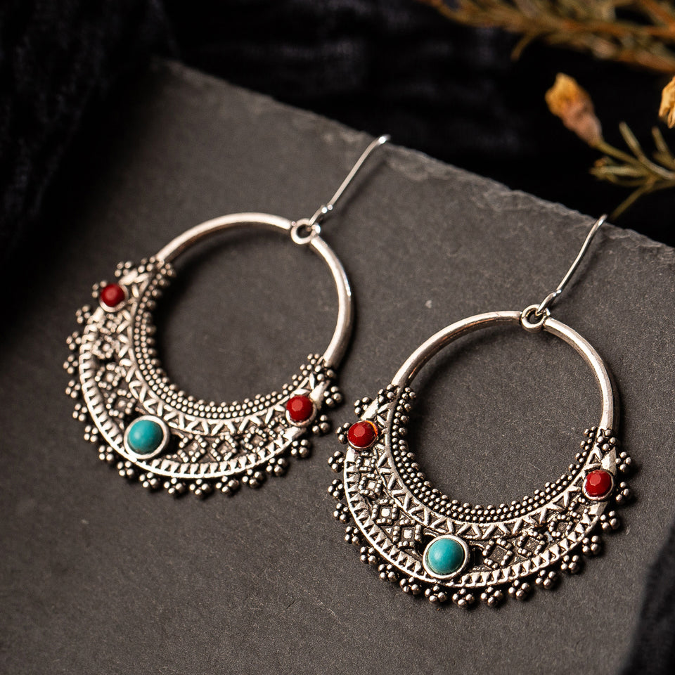 Drop-shaped alloy pendant earrings