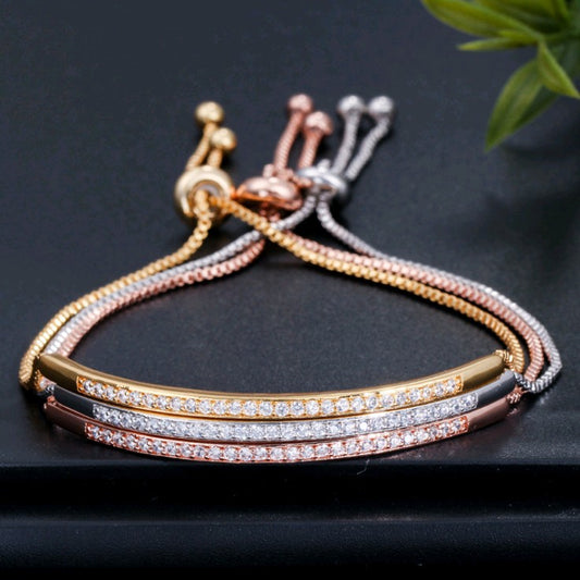 Single row curved bracelet with zircon and diamonds