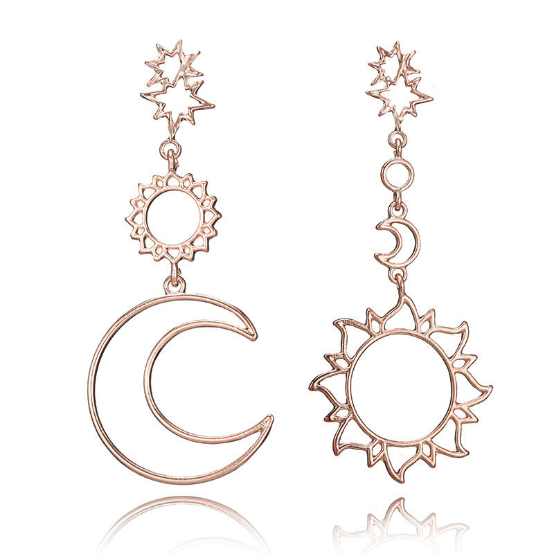 Asymmetric exaggerated moon sun earrings